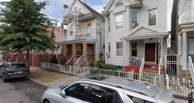 outside of a two-story house in Cypress Hills in Brooklyn